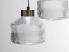 Pharos fresnel inspired glass pendant lamp and bronze cap